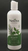 The Netriva shampoo bottle on a bathroom shelf in daylight